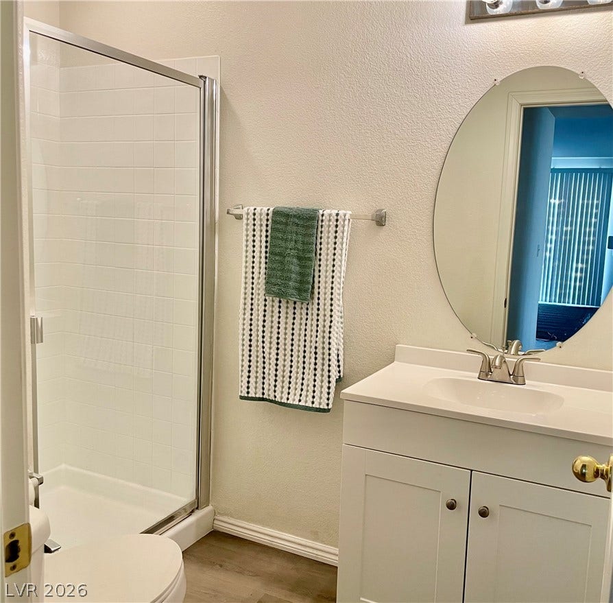 1891 Eagle Flight Lane, Henderson, NV 89012 Clean lines and modern finishes define this functional downstairs bathroom space.