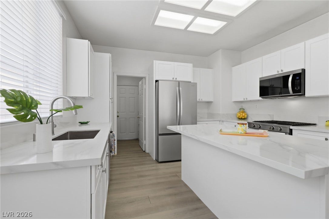 1891 Eagle Flight Lane, Henderson, NV 89012 Clean lines and stone countertops define this modern cooking space.