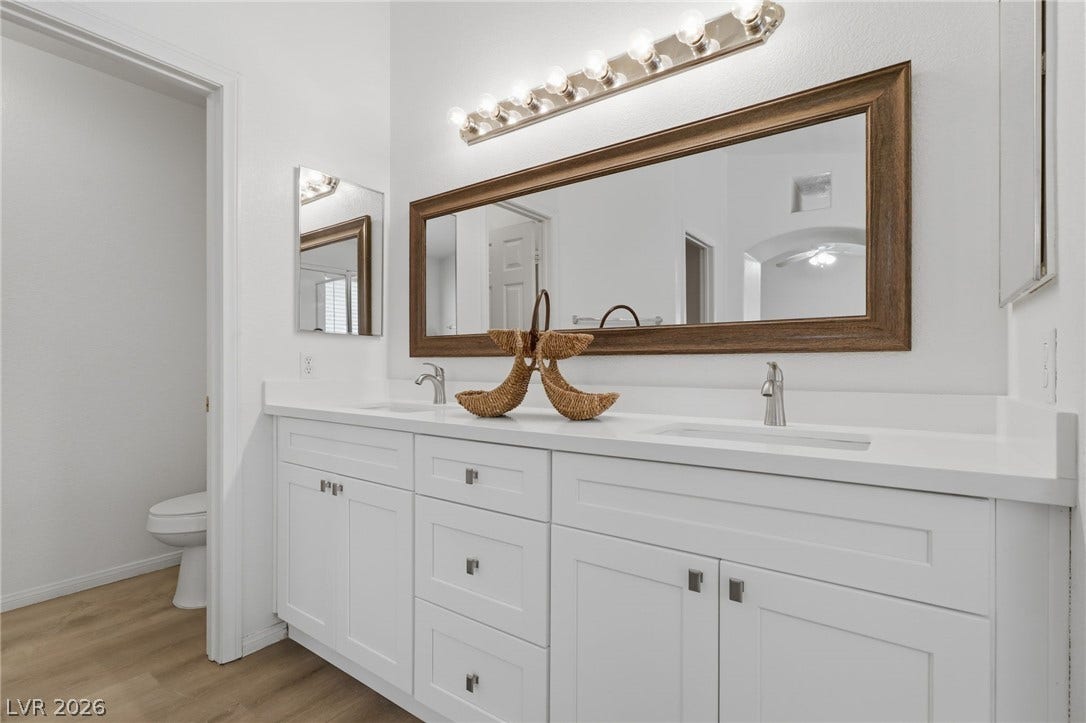 1891 Eagle Flight Lane, Henderson, NV 89012 Clean lines and a spacious dual vanity highlight this contemporary restroom space.