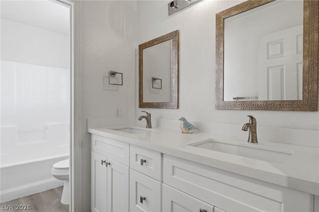 1891 Eagle Flight Lane, Henderson, NV 89012 Clean lines and a spacious double vanity define this updated primary bathroom.