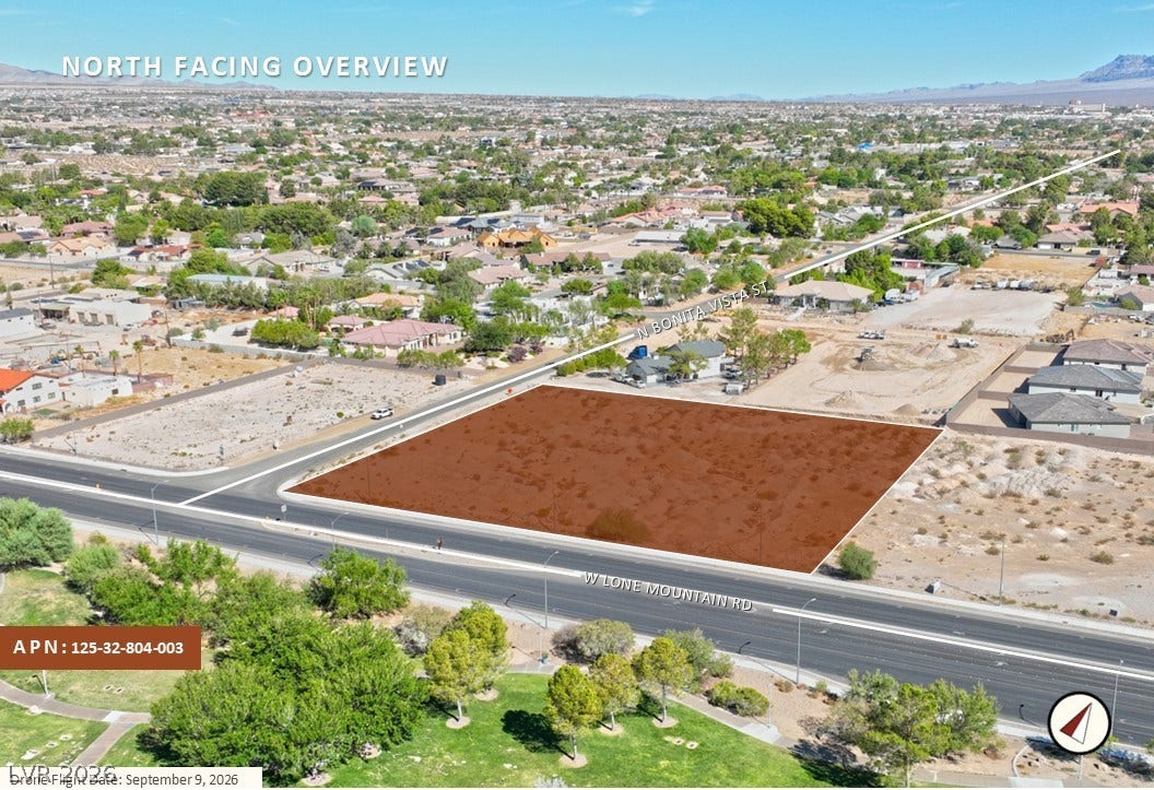 West Lone Mountain, Las Vegas, NV 89149 A north-facing aerial perspective highlights this prime desert land parcel outlined along the roadway.