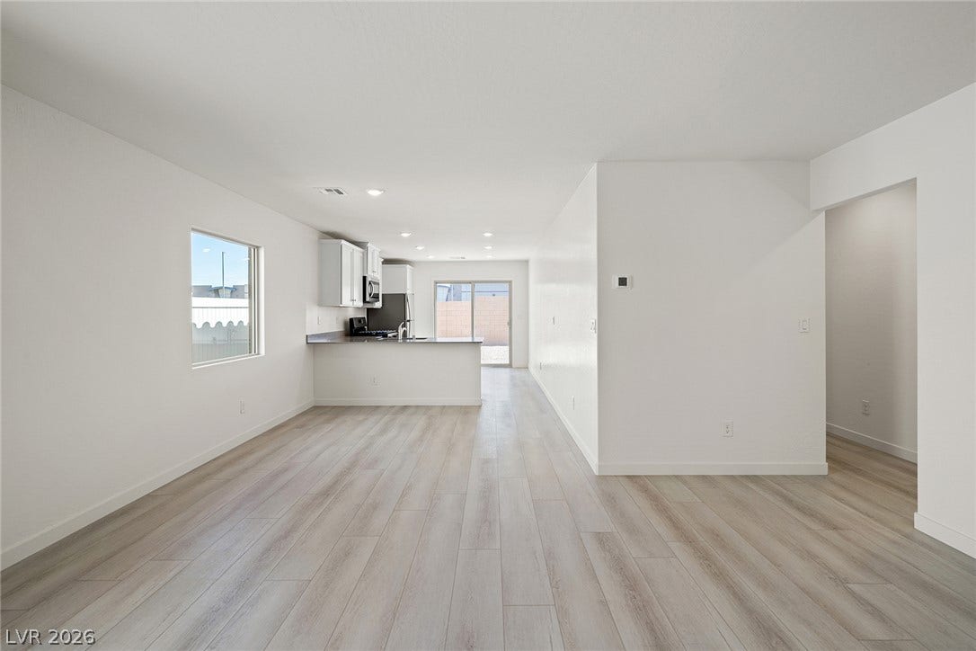 6760 Violet Cascade Avenue, Las Vegas, NV 89156 An open floorplan seamlessly connects the airy living area to the kitchen.