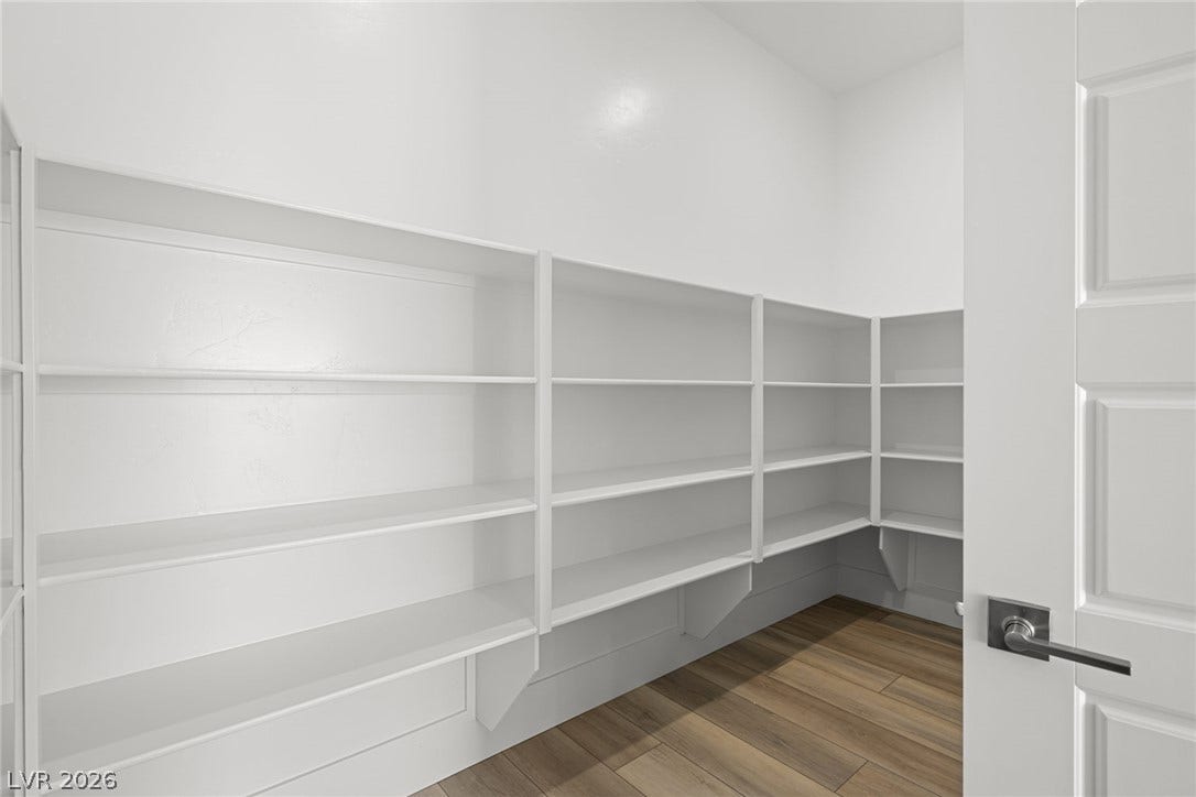 12428 Breezy Bluff Avenue, Las Vegas, NV 89138 Ample built-in shelving wraps around this storage space lined with durable tile flooring.