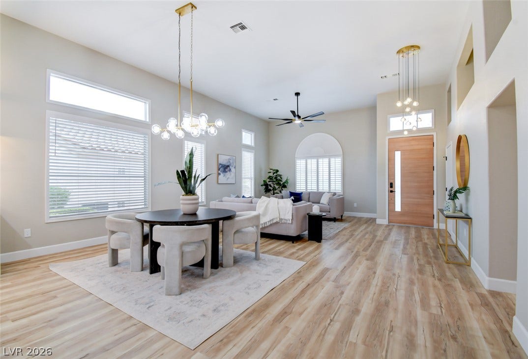 2837 Billy Casper Drive, Las Vegas, NV 89134 High ceilings and clean luxury vinyl flooring enhance this inviting, sunlit open-concept living space.