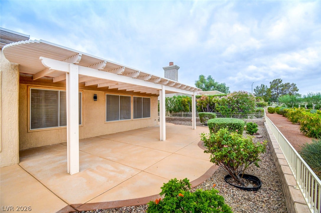 2837 Billy Casper Drive, Las Vegas, NV 89134 A spacious covered patio features clean concrete flooring overlooking 5th hole on golf course.