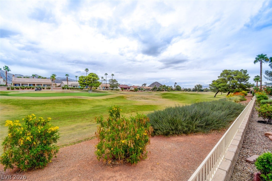 2837 Billy Casper Drive, Las Vegas, NV 89134 Lush fairways stretch out behind the property, framed by a low wall and desert plantings.