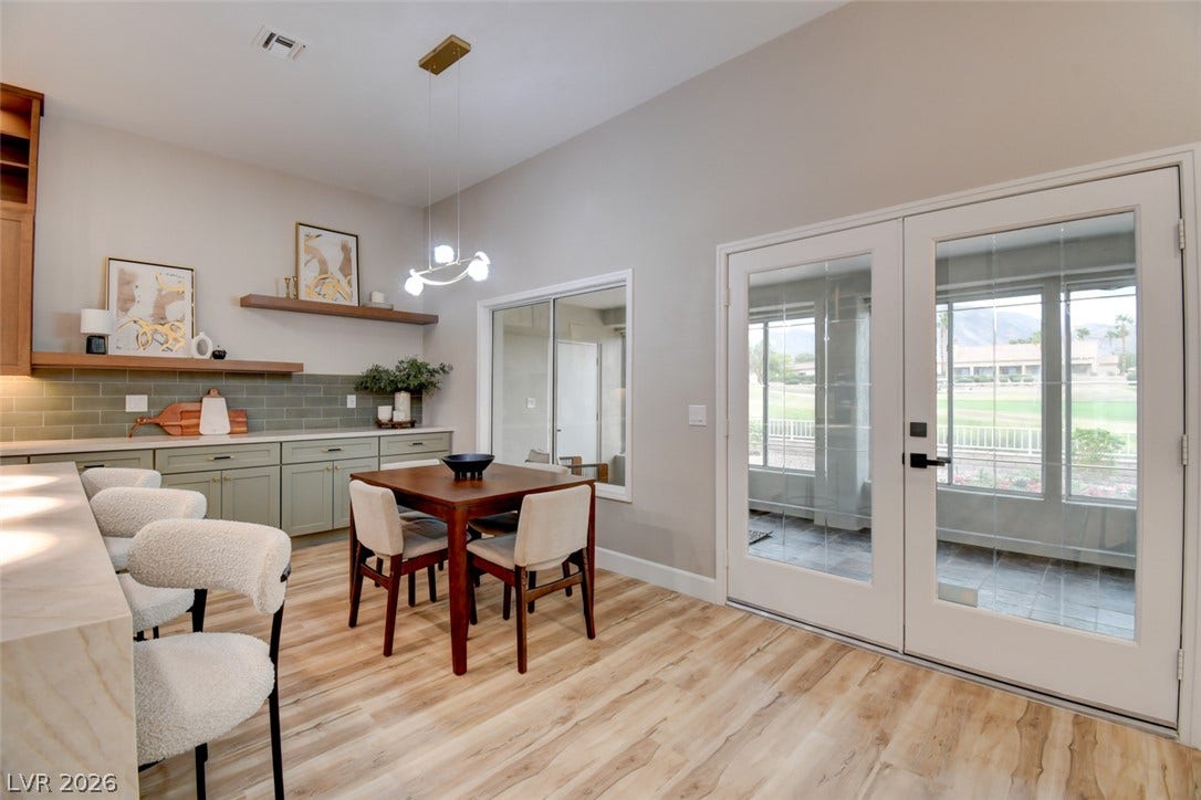 2837 Billy Casper Drive, Las Vegas, NV 89134 Gleaming luxury vinyl floors anchor this casual dining area featuring expansive glass doors to the patio.