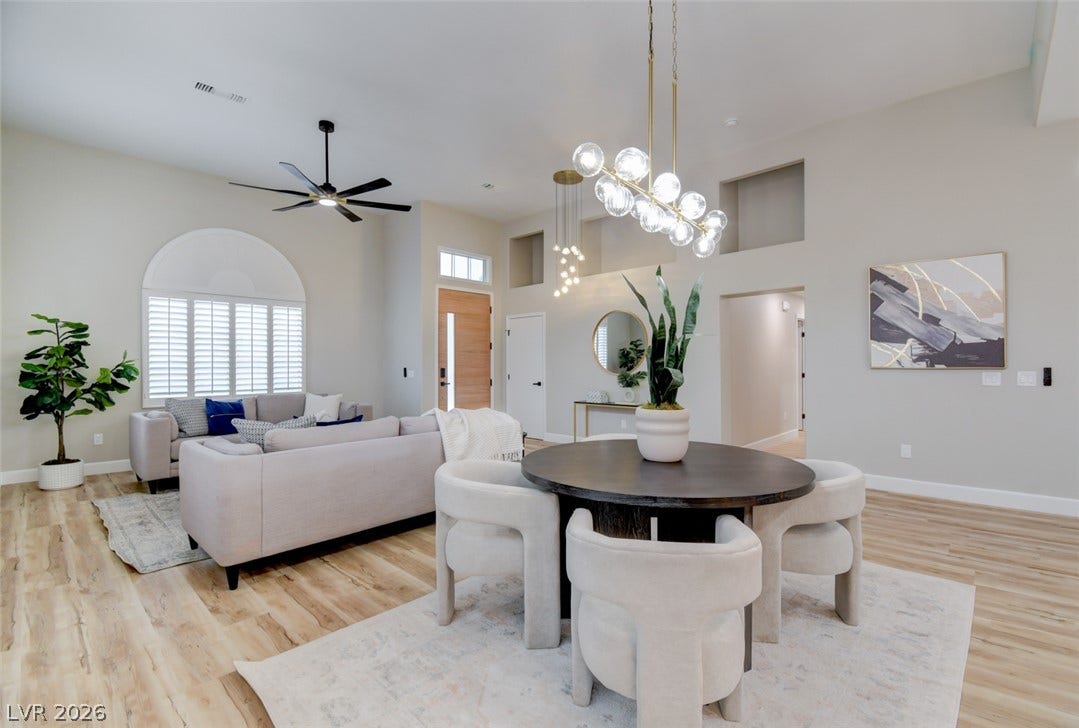 2837 Billy Casper Drive, Las Vegas, NV 89134 An open floor plan connects the light-filled dining space with the living area.