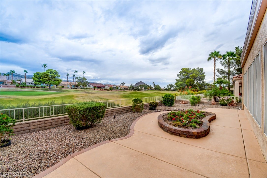 2837 Billy Casper Drive, Las Vegas, NV 89134 Concrete patio overlooking the golf course greens and mountain skyline.