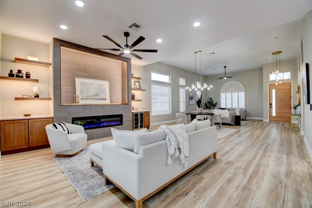 2837 Billy Casper Drive, Las Vegas, NV 89134 An open floor plan integrates living and dining areas under tall ceilings with recessed lighting.