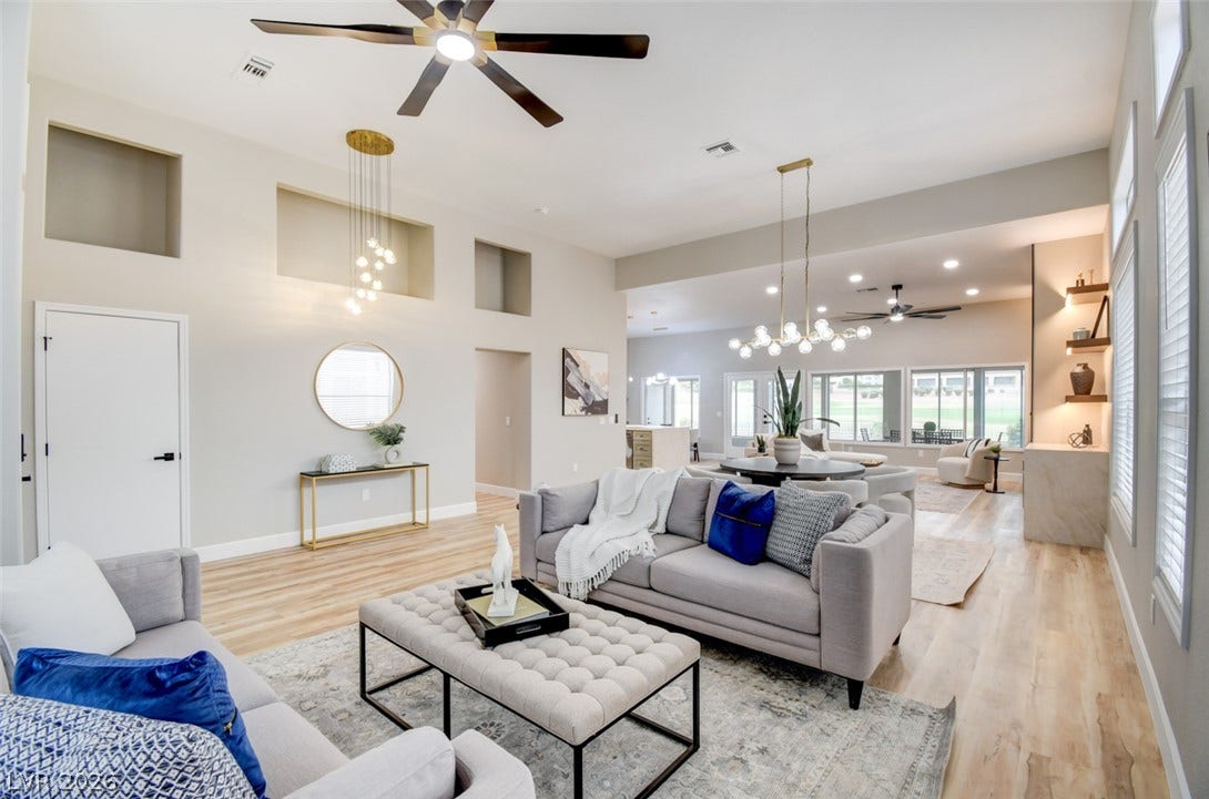 2837 Billy Casper Drive, Las Vegas, NV 89134 High ceilings and clean lines define this expansive, light-filled living area with luxury vinyl floors.