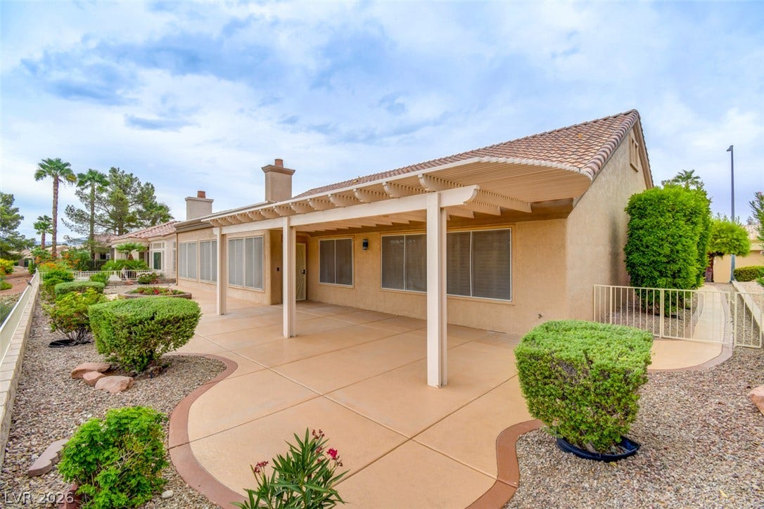 2837 Billy Casper Drive, Las Vegas, NV 89134 An expansive covered patio creates a shaded outdoor retreat looking out over the desert landscaping.