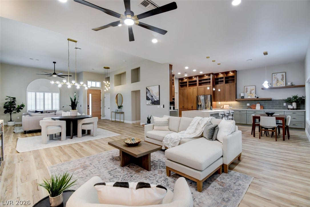 2837 Billy Casper Drive, Las Vegas, NV 89134 An open floorplan seamlessly connects the airy living and dining spaces under high ceilings.