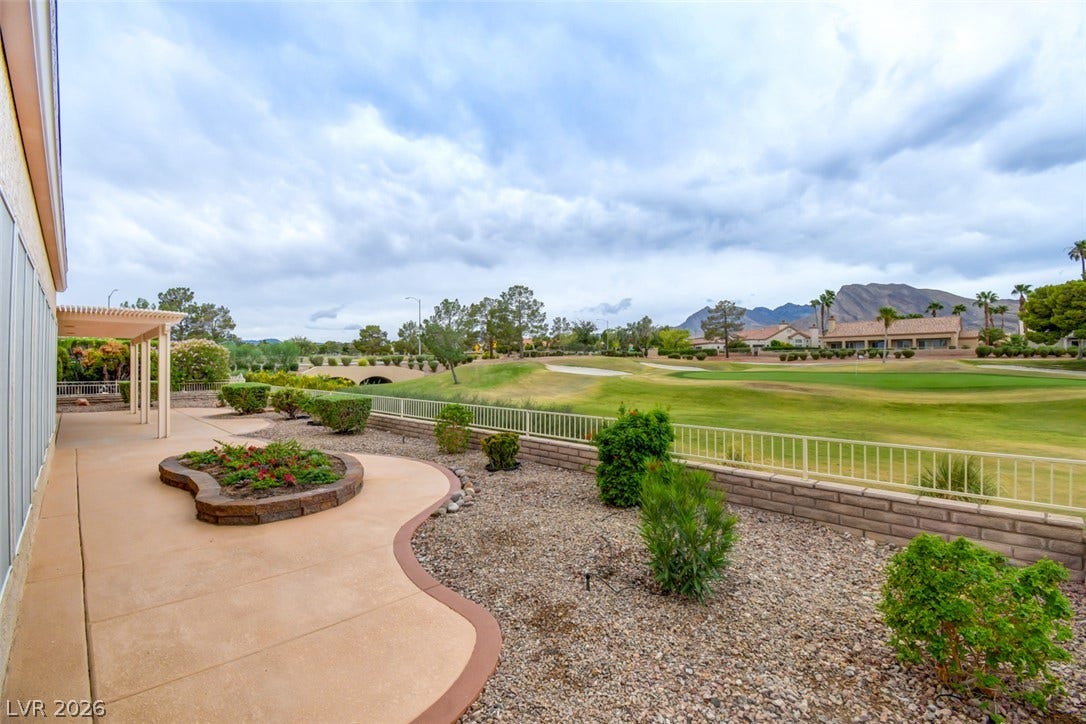 2837 Billy Casper Drive, Las Vegas, NV 89134 Sweeping fairways and rugged mountain peaks form the backdrop of this expansive desert patio.