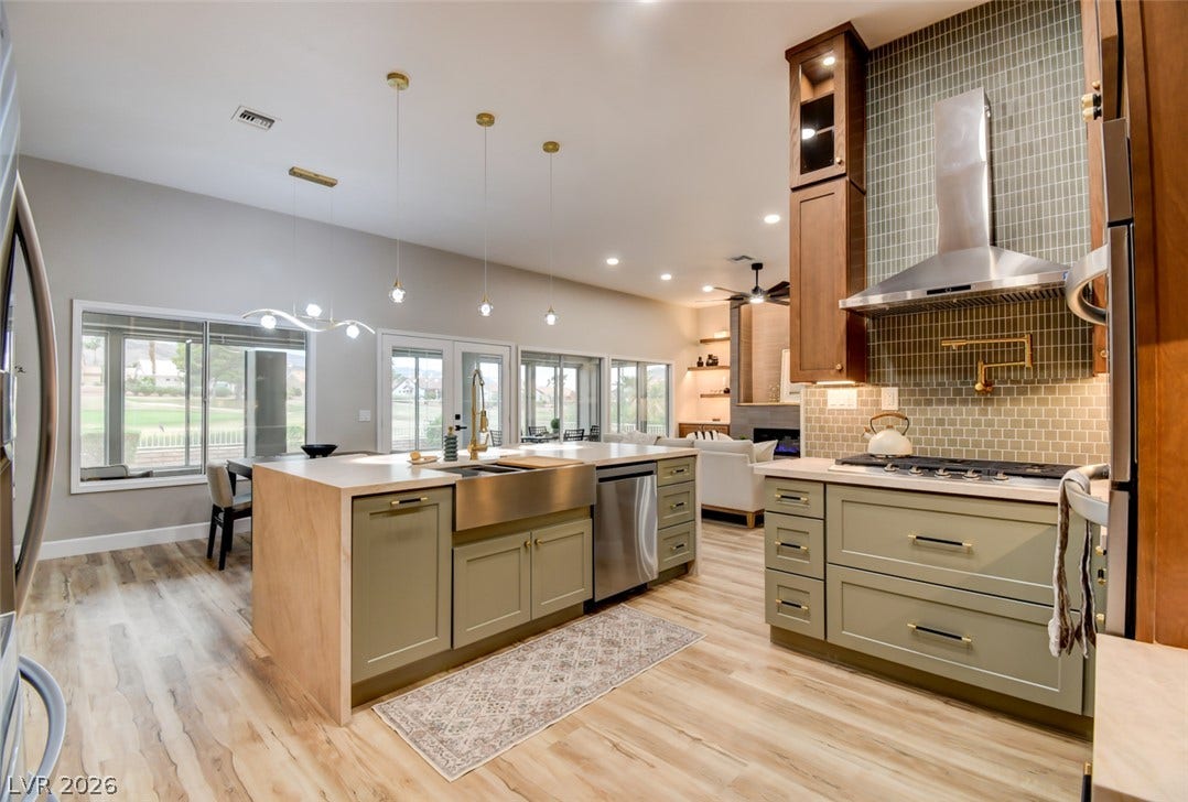 2837 Billy Casper Drive, Las Vegas, NV 89134 Kitchen has a farmhouse sink, pull-out for garbage & recycle bins.
