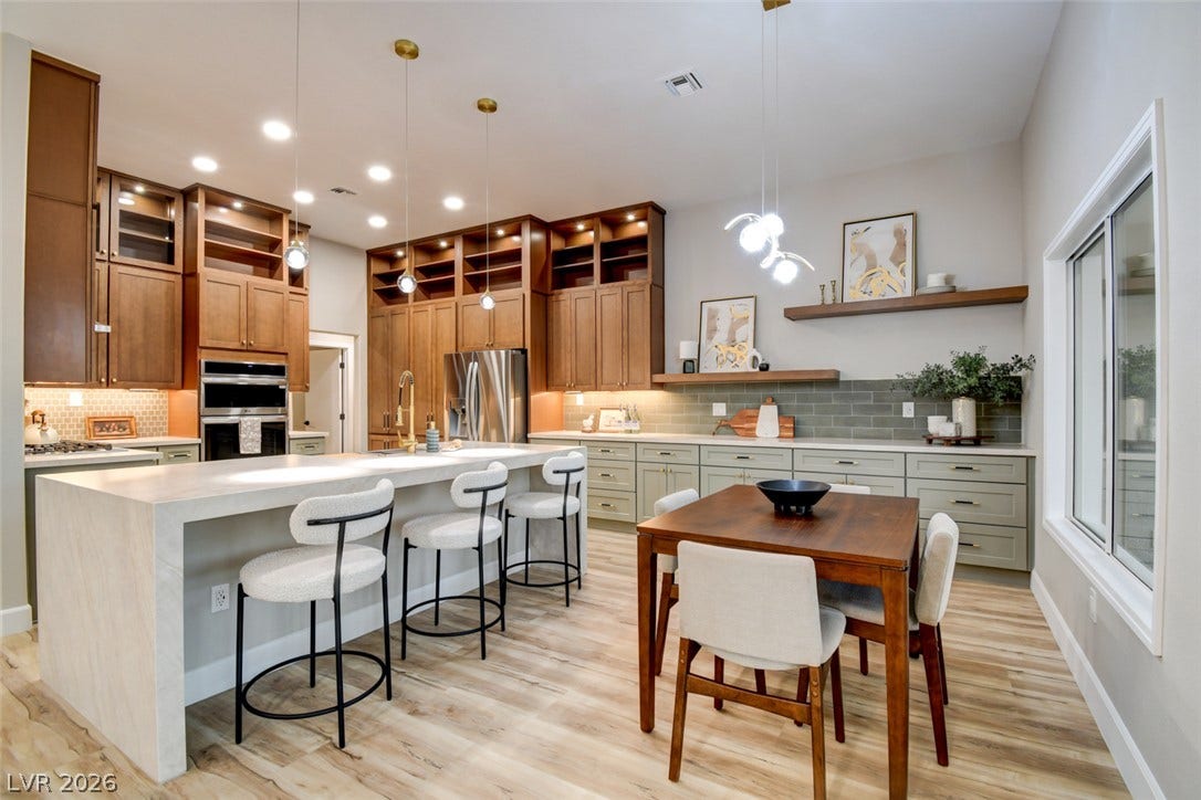 2837 Billy Casper Drive, Las Vegas, NV 89134 Warm wood cabinetry and durable flooring frame a generously sized central island.