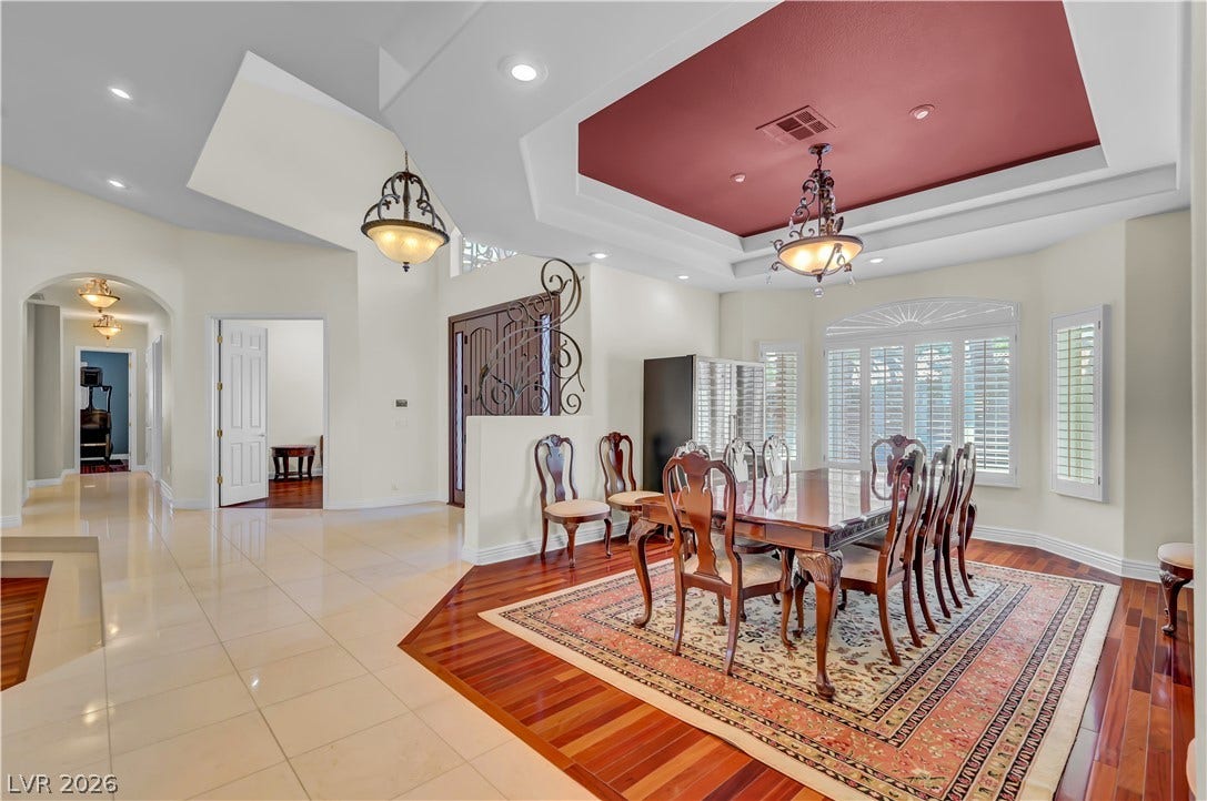 2030 Marina Bay Court, Las Vegas, NV 89117 Ornate tray ceilings highlight this formal dining space framed by polished tile and hardwood floors.