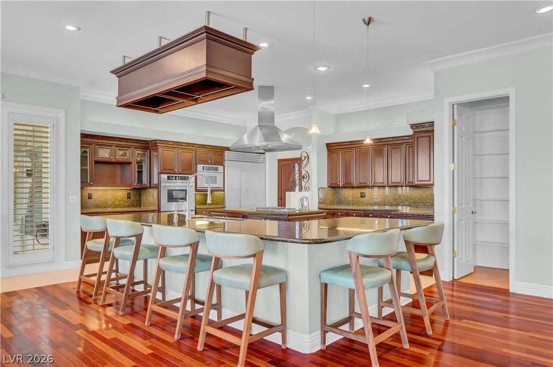 2030 Marina Bay Court, Las Vegas, NV 89117 Gleaming hardwood floors and classic crown moldings enhance this generously proportioned culinary space.