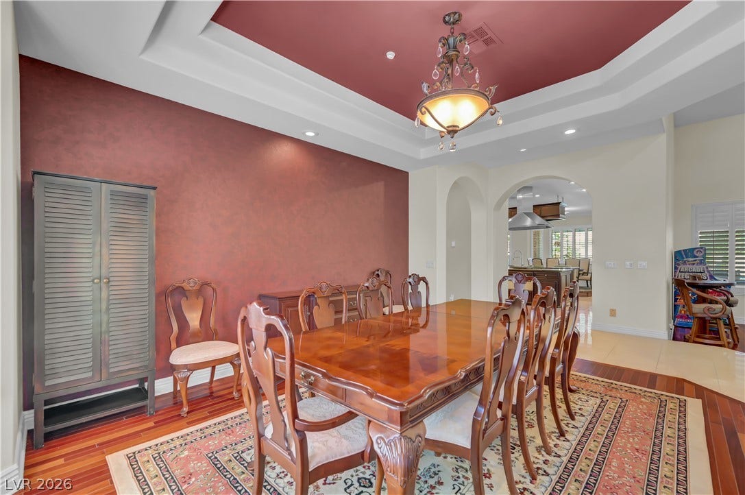 2030 Marina Bay Court, Las Vegas, NV 89117 An elegant tray ceiling with custom inset lighting crowns this formal dining space.