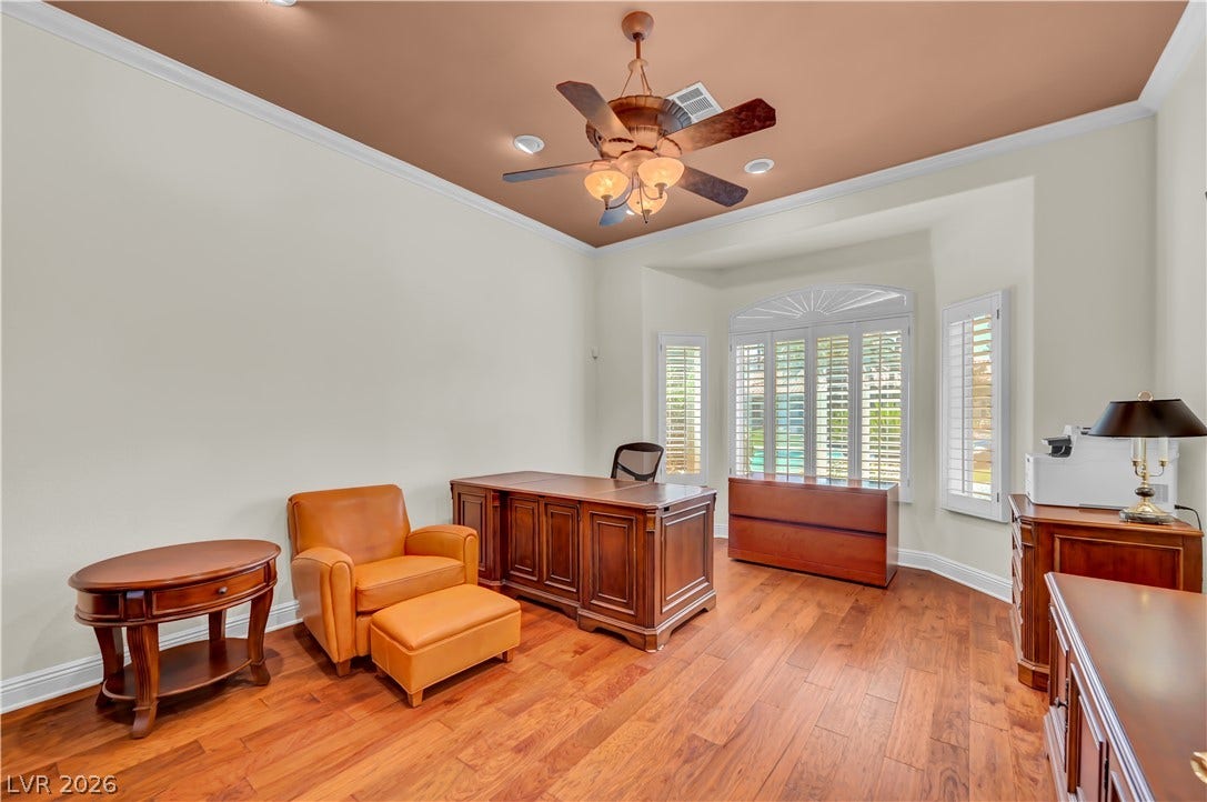 2030 Marina Bay Court, Las Vegas, NV 89117 Rich hardwood floors and plantation shutters define this versatile home workspace.