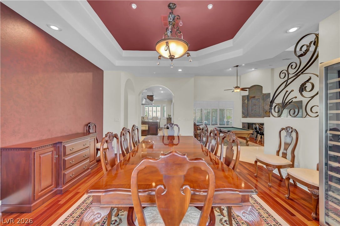 2030 Marina Bay Court, Las Vegas, NV 89117 Rich hardwood floors complement an elegant tray ceiling in this formal dining space.