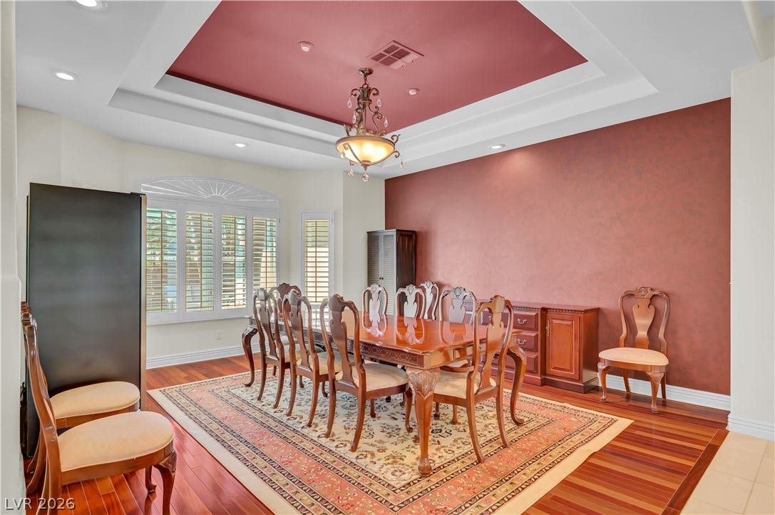 2030 Marina Bay Court, Las Vegas, NV 89117 Rich hardwood floors complement an elegant recessed ceiling in this formal dining room.