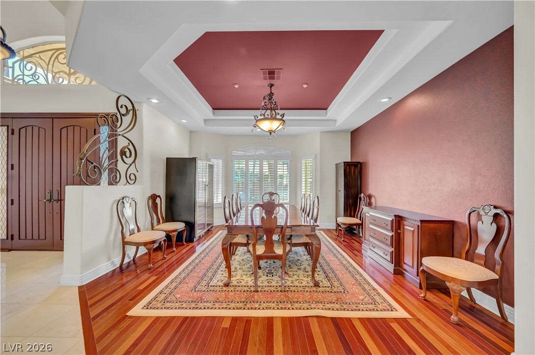2030 Marina Bay Court, Las Vegas, NV 89117 Gleaming hardwood floors and a recessed tray ceiling define this elegant formal dining area.