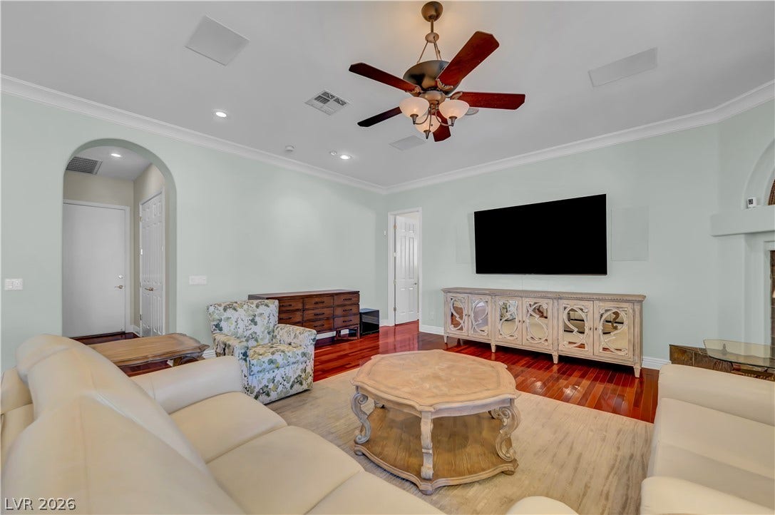 2030 Marina Bay Court, Las Vegas, NV 89117 Rich hardwood flooring and arched entryways define this welcoming living space.
