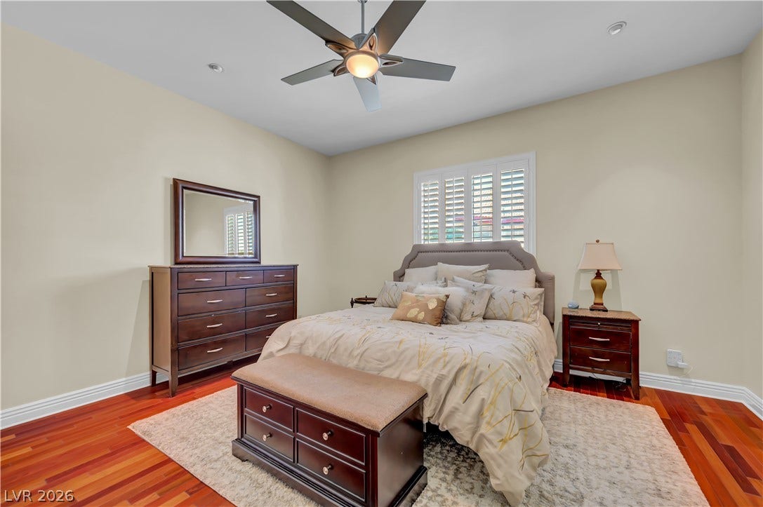 2030 Marina Bay Court, Las Vegas, NV 89117 Rich hardwood floors and elegant crown molding elevate this serene sleeping space.