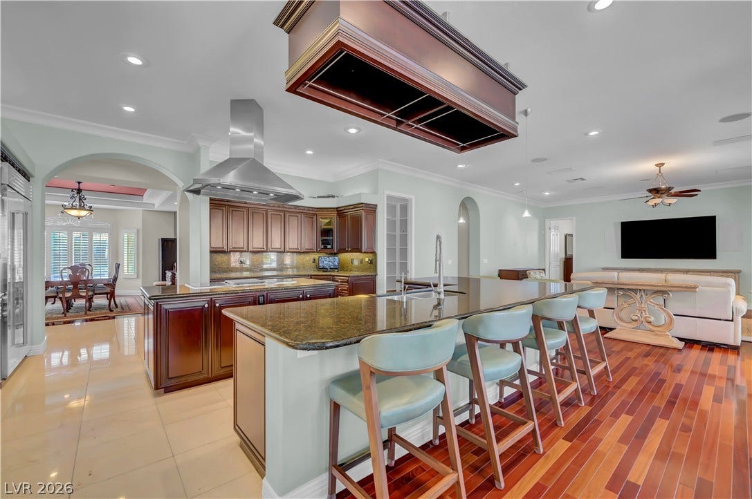 2030 Marina Bay Court, Las Vegas, NV 89117 Rich hardwood floors contrast beautifully with tiled surfaces in this open concept cooking space.