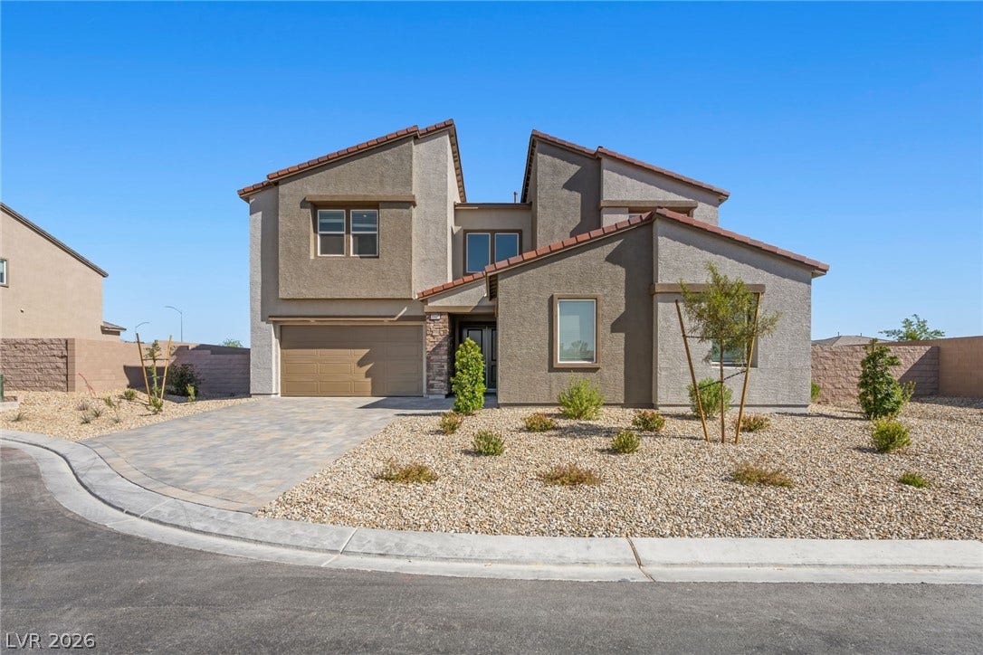Modern desert architectural lines and low-maintenance landscaping create an inviting, contemporary facade.