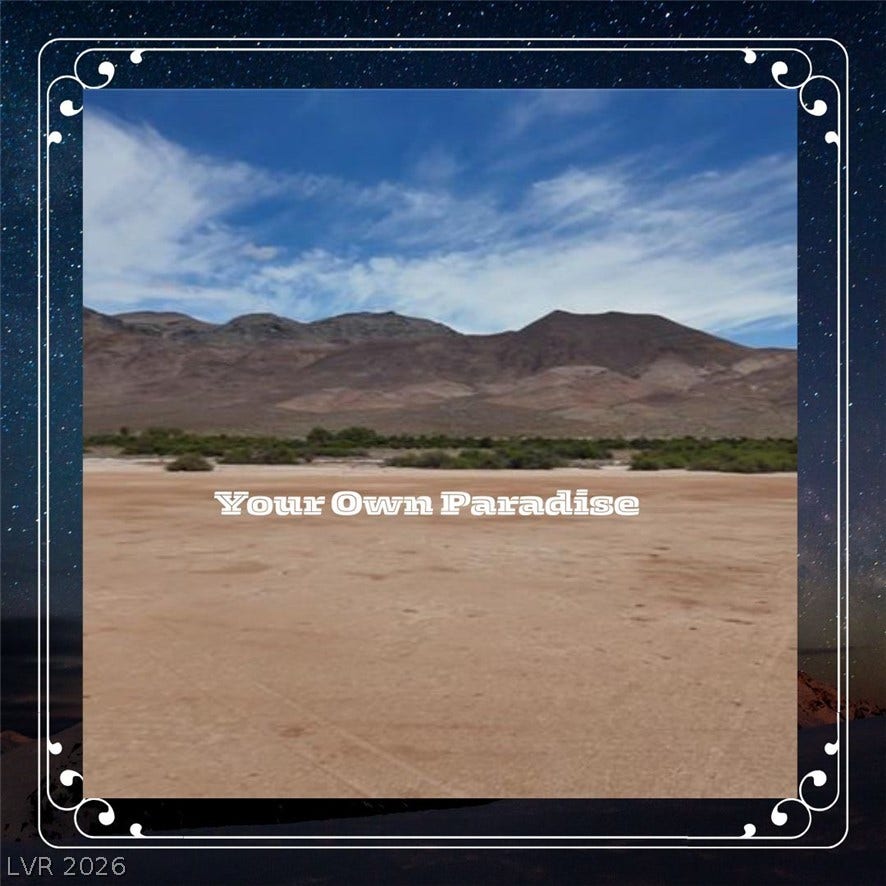 Rugged mountains frame this expansive desert property under a vast blue sky.