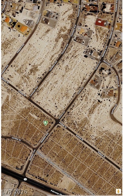 An aerial map highlights the surrounding desert landscape and established street grid of the property.