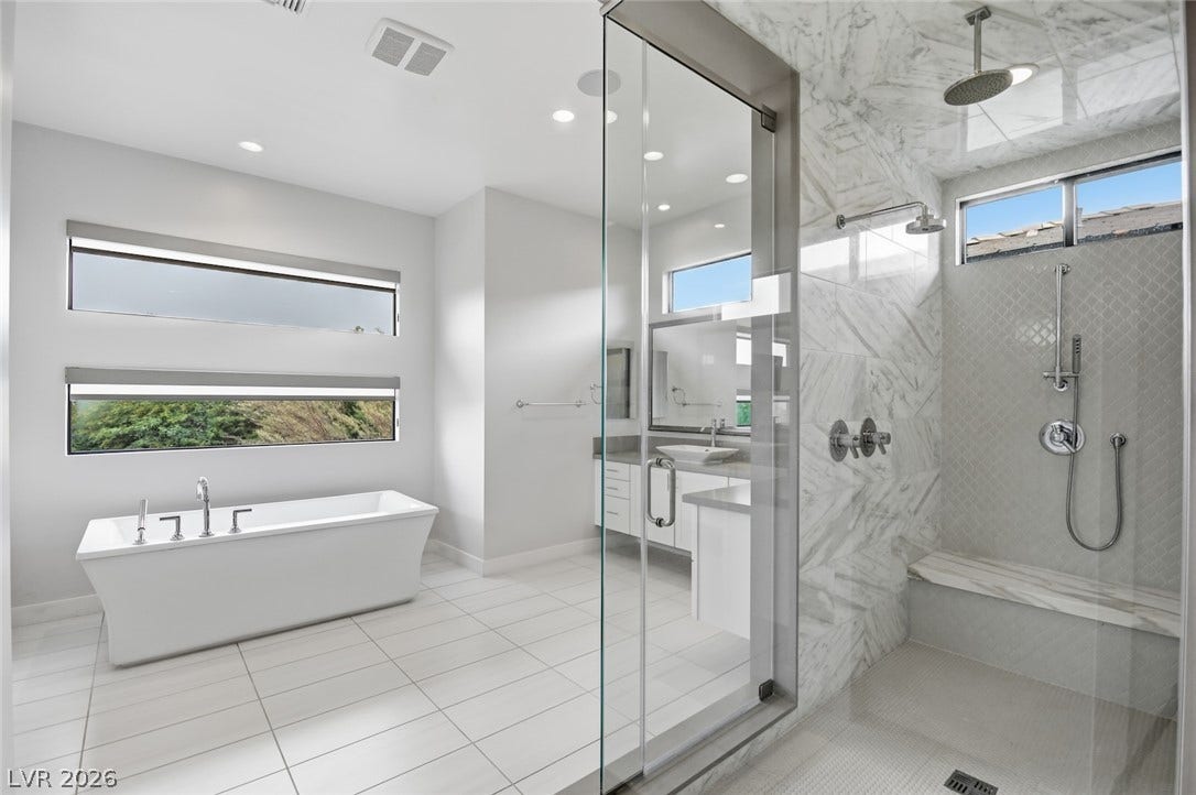 1 Moonfire Drive, Las Vegas, NV 89135 Luxurious design defines this bathroom featuring a freestanding tub and walk-in marble shower.