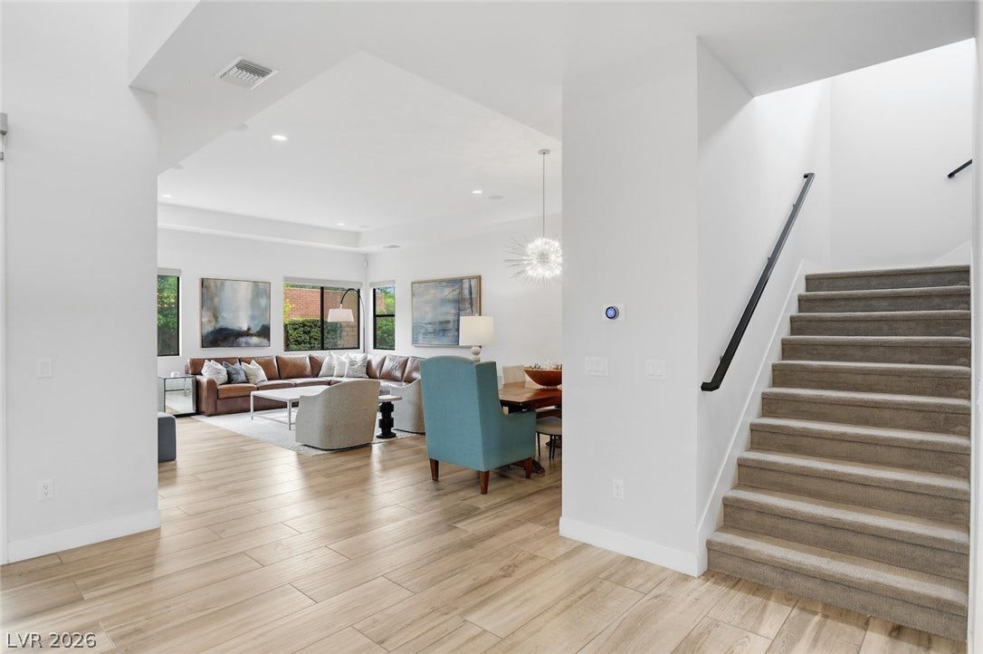 1 Moonfire Drive, Las Vegas, NV 89135 An open floorplan seamlessly connects the airy living spaces bordered by wood-look tile floors.