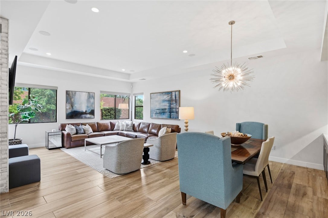 1 Moonfire Drive, Las Vegas, NV 89135 Polished hardwood floors sweep through an open interior highlighted by elegant recessed lighting.