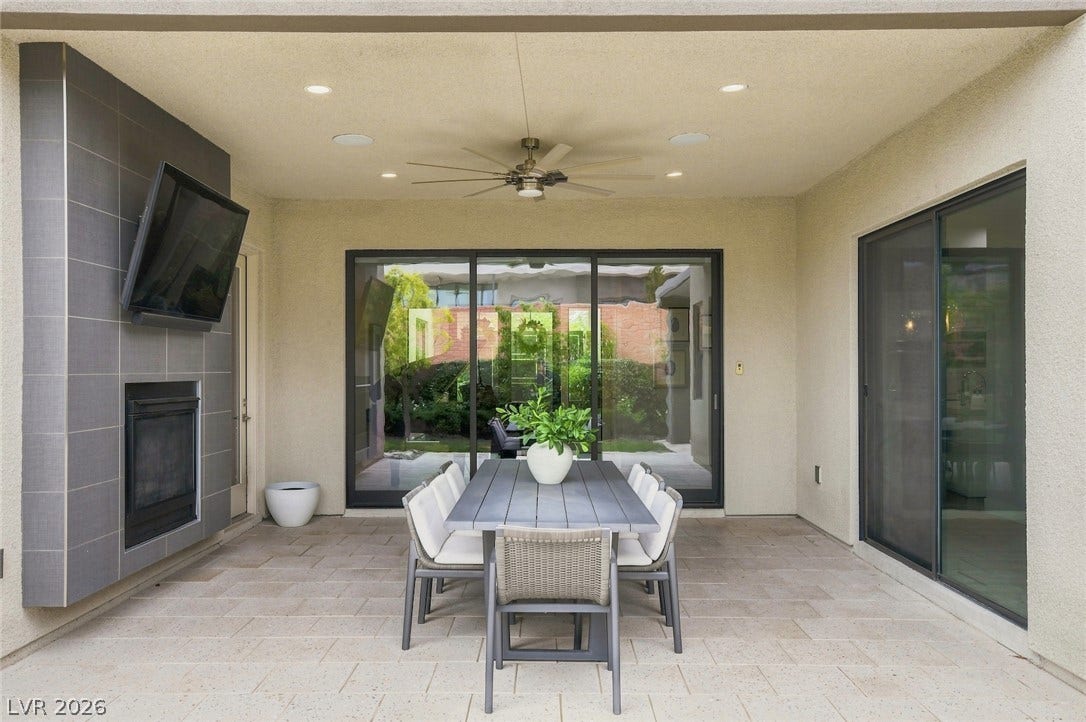 1 Moonfire Drive, Las Vegas, NV 89135 Sheltered outdoor living transitions seamlessly inside through expansive sliding glass doors.
