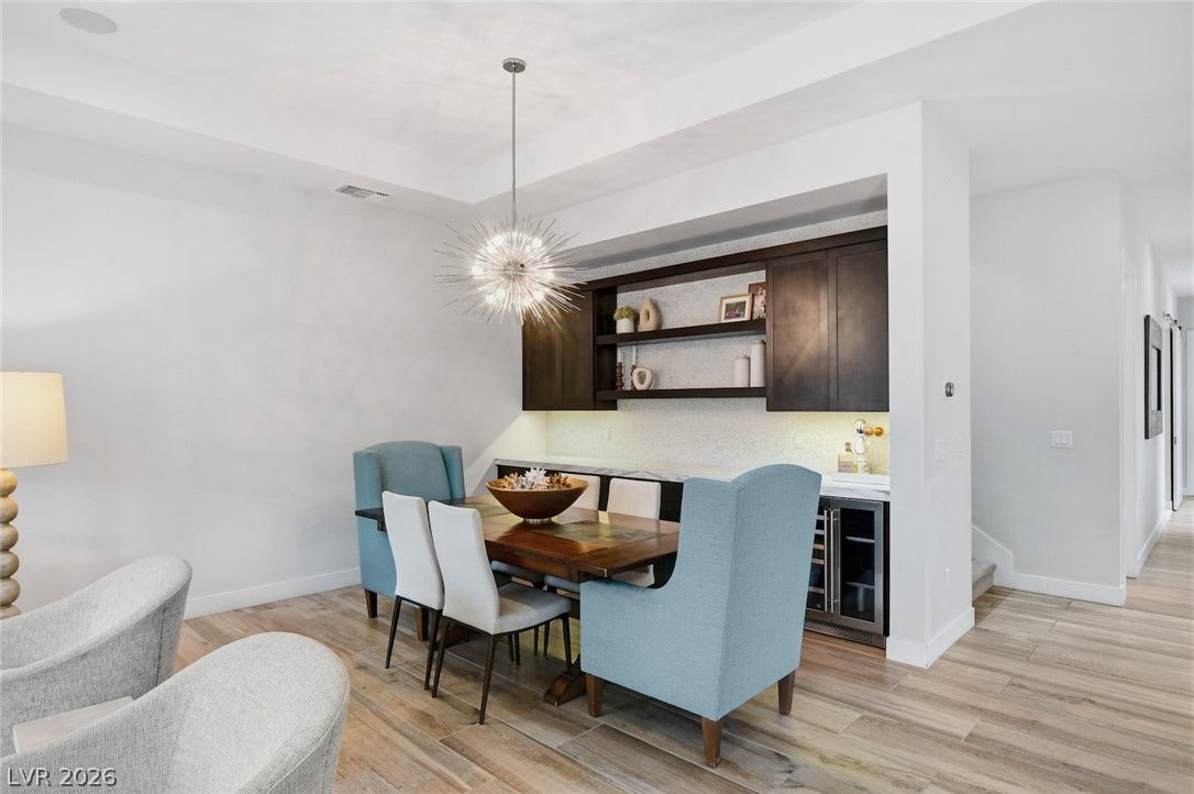 1 Moonfire Drive, Las Vegas, NV 89135 Warm wood flooring and built-in cabinetry define this modern dining space.