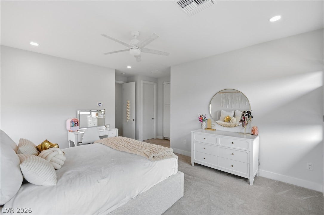 1 Moonfire Drive, Las Vegas, NV 89135 Plush carpeting and crisp white walls create a serene and restful bedroom retreat.