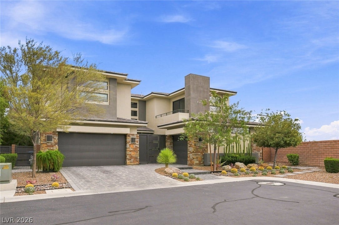 1 Moonfire Drive, Las Vegas, NV 89135 Bold geometric lines and stone accents define this modern desert exterior design.