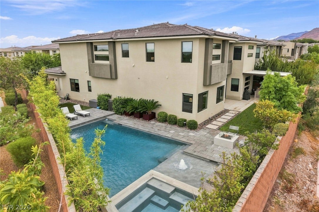 1 Moonfire Drive, Las Vegas, NV 89135 A pristine swimming pool and patio area complement this modern two-story home.