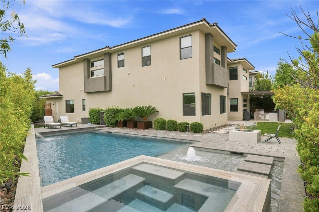 1 Moonfire Drive, Las Vegas, NV 89135 A sparkling geometric pool and custom spa sit integrated into the modern stone patio design.