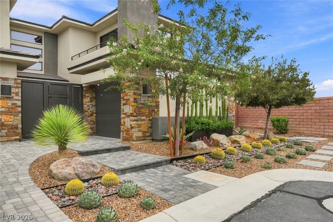 1 Moonfire Drive, Las Vegas, NV 89135 Bold stone columns and contemporary lines create a striking first impression for this modern estate.