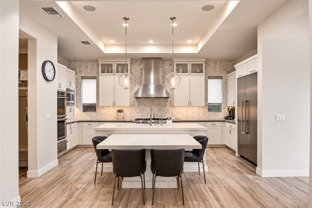 1 Moonfire Drive, Las Vegas, NV 89135 Gleaming stone surfaces and an integrated breakfast bar anchor this modern culinary space.