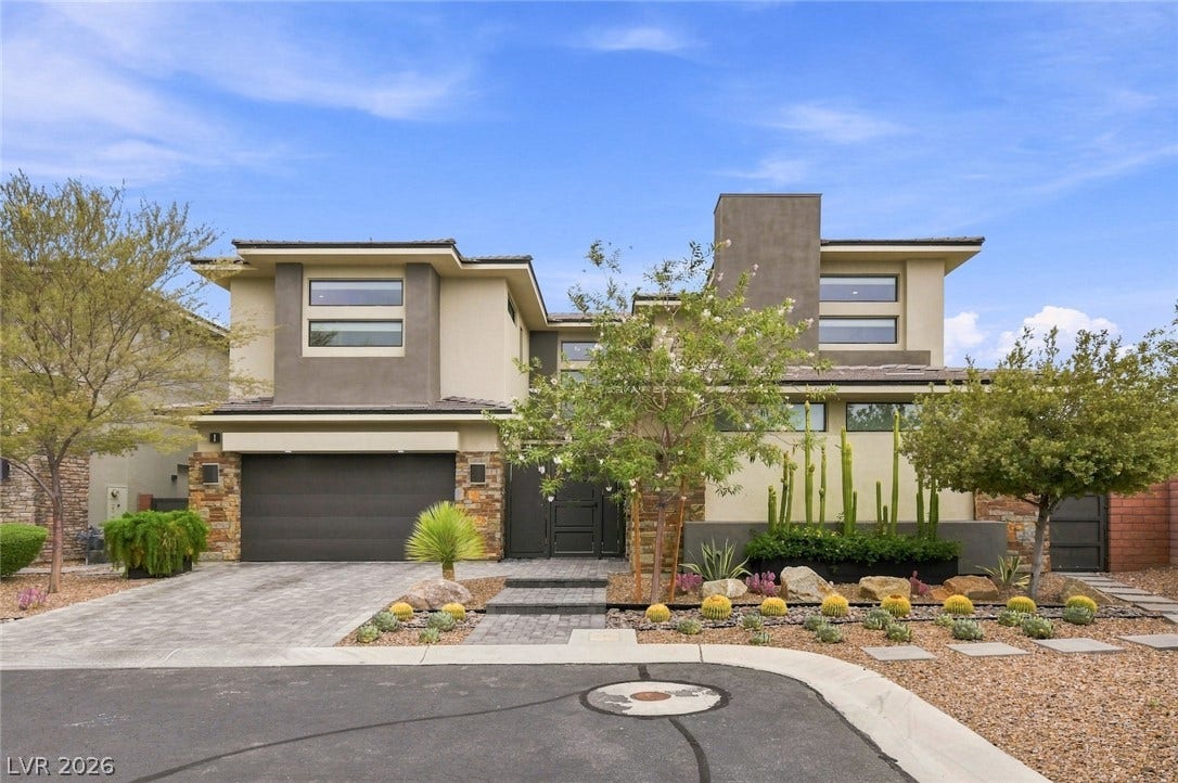 1 Moonfire Drive, Las Vegas, NV 89135 Modern lines and desert-friendly landscaping define this contemporary multi-level exterior design.