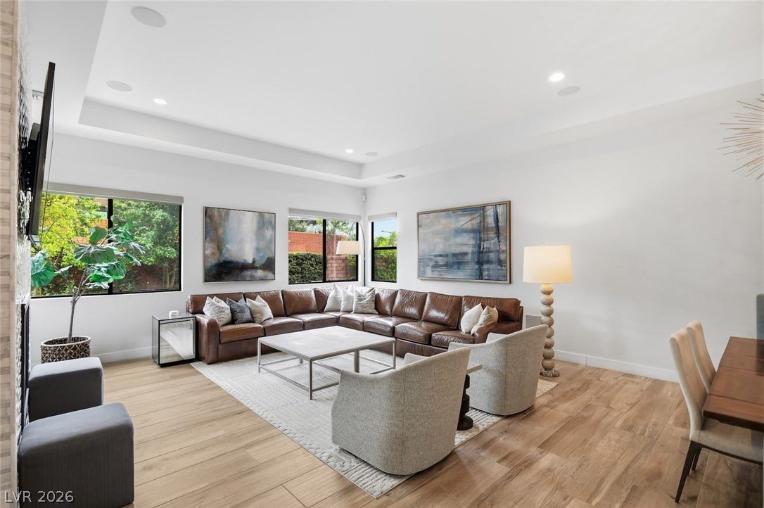 1 Moonfire Drive, Las Vegas, NV 89135 An open and airy living area boasts rich wood floors under a tray ceiling.