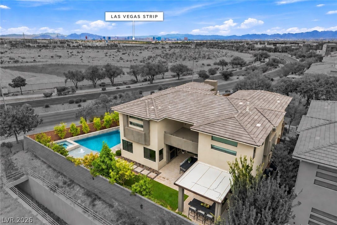 1 Moonfire Drive, Las Vegas, NV 89135 Distant skyline views highlight this contemporary multi-level residence with a private swimming pool.