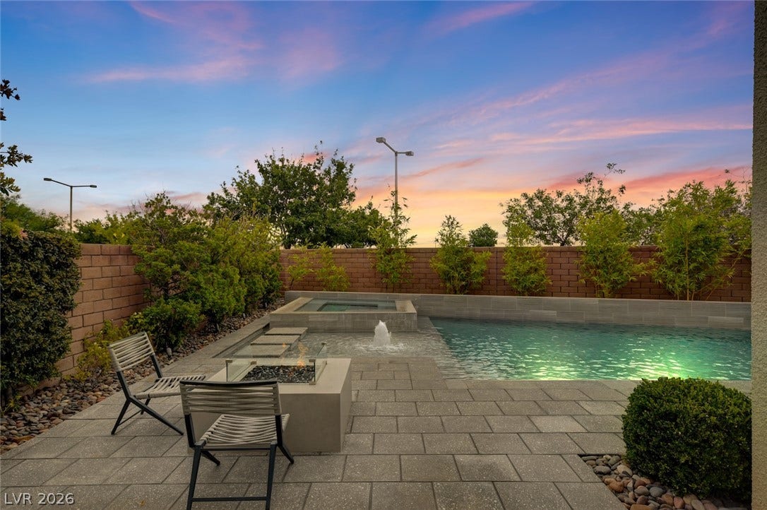 1 Moonfire Drive, Las Vegas, NV 89135 A sparkling swimming pool, built-in spa, and concrete paver patio create a private outdoor oasis.