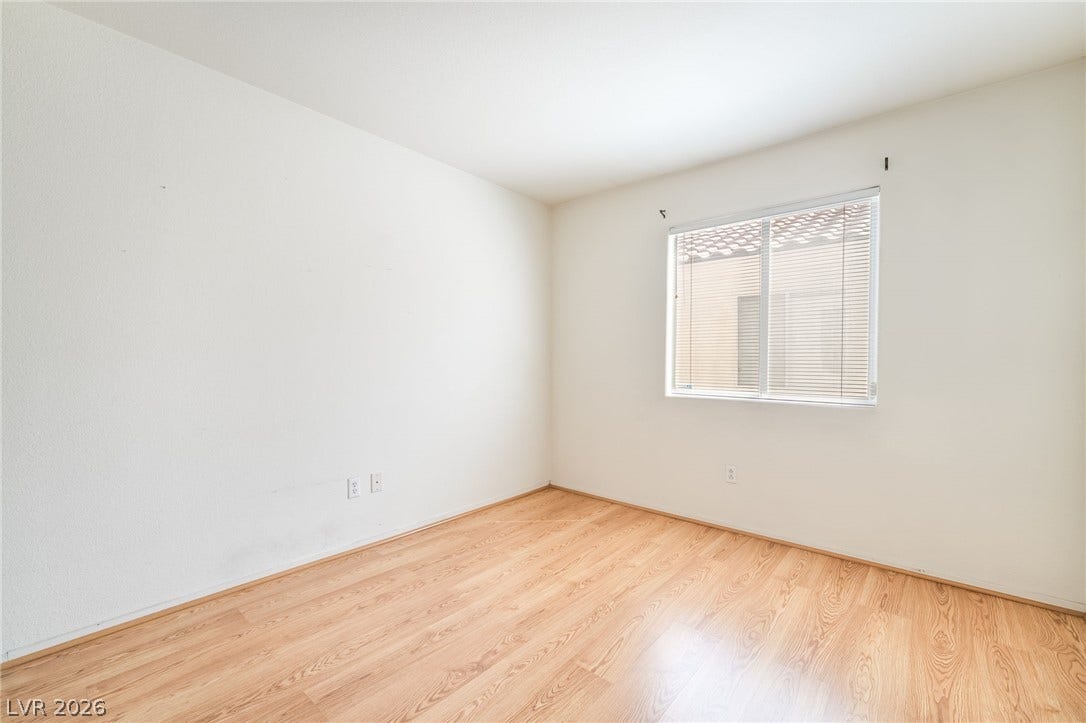 769 Salt Flats Circle, Henderson, NV 89011 Warm wood floors and clean neutral walls anchor this sunlit space.