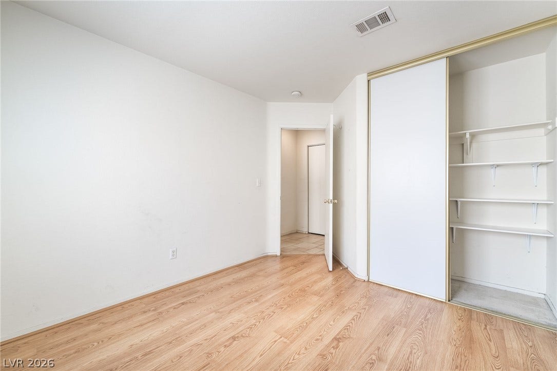 769 Salt Flats Circle, Henderson, NV 89011 Gleaming wood flooring and built-in closet shelving define this versatile room.